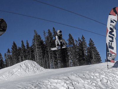 Samuel is snowboarding